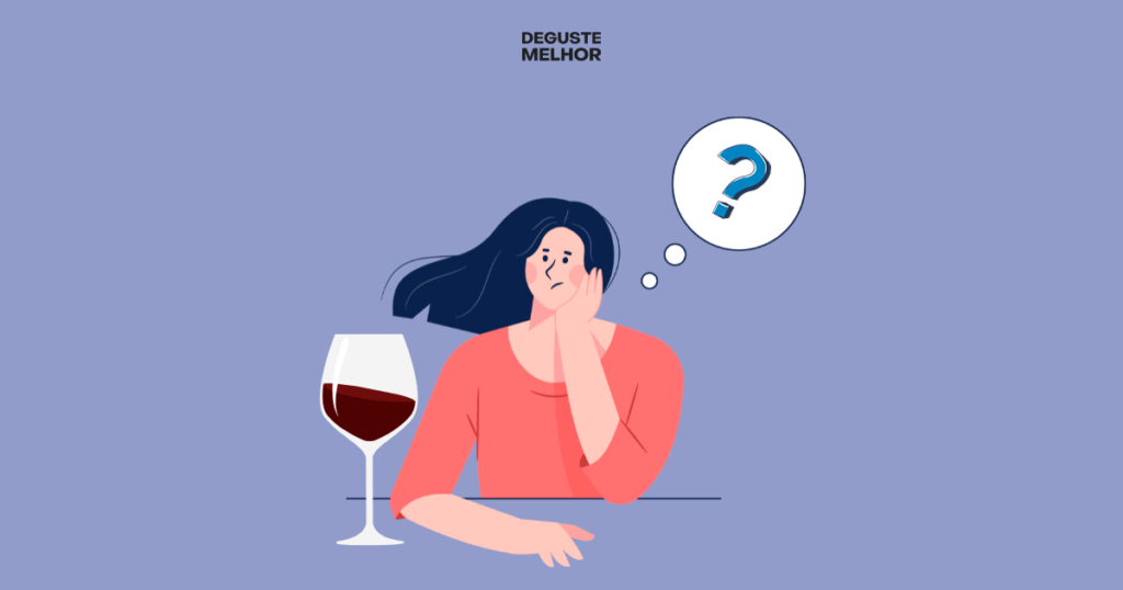 Mulher pensativa olhando uma taça de vinho